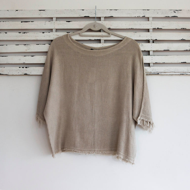 Natural woven linen top with frayed sleeves and hem