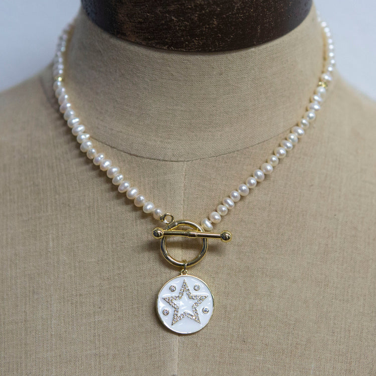 Pearl necklace with gold fob and star charm